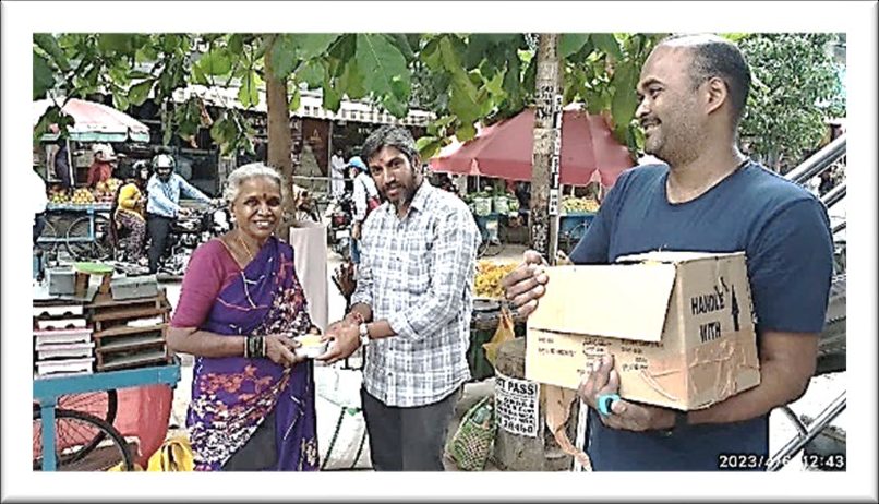A commodity kit being given to an elderly woman